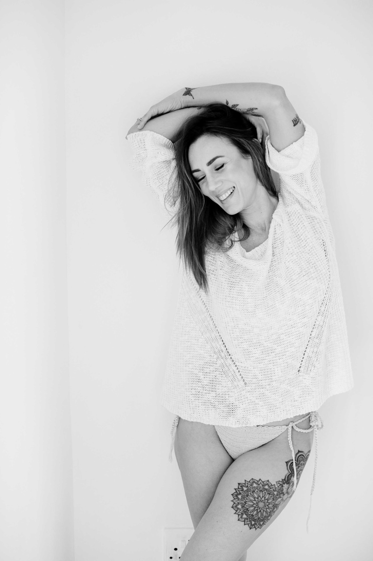 Joyful black and white Jules Morgan portrait in soft light